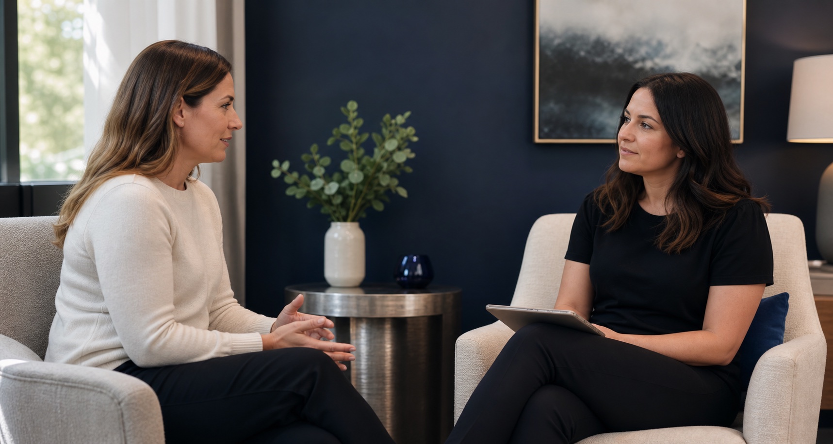A calm private consultation between a practitioner and a client